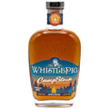 WhistlePig CampStock Wheat Whiskey bottle, an amber liquid-filled clear glass bottle featuring a prominent blue label with a pig mascot, "CampStock" and "Solo Stove" branding with a rustic forest silhouette and a blazing campfire icon, further distinguished by a Campfire Club Solo Stove medallion on its neck